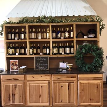 Stoneledge Winery - a display of bottles of wine - Wineries Near Me - Lometa, Texas