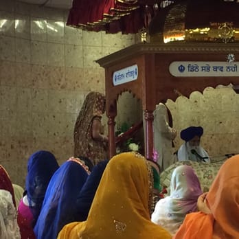 Ontario Khalsa Darbar - Part of the ceremony where the groom leads the bride in walking around the Guru. - Religious Organizations Near Me - Mississauga, Ontario Ontario Khalsa Darbar - Part of the ceremony where the groom leads the bride in walking around the Guru. - Religious Organizations Near Me - Mississauga, Ontario