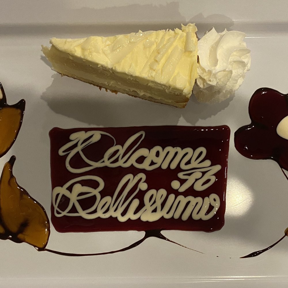 Bellissimo - Lemoncello cake with raspberry, white chocolate, and caramel freehand design. - Italian Near Me - Montvale, New Jersey Bellissimo - Lemoncello cake with raspberry, white chocolate, and caramel freehand design. - Italian Near Me - Montvale, New Jersey