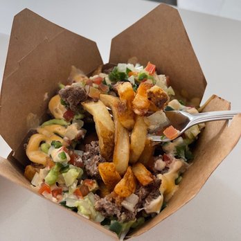 Top Gun Steak & Burger - a fork in a box of fries - Burgers Near Me - Vaughan, Ontario Top Gun Steak & Burger - a fork in a box of fries - Burgers Near Me - Vaughan, Ontario