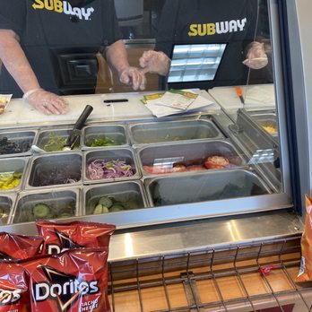 Subway - a man and a woman preparing food in a subway - Sandwiches Near Me - Fenton, Michigan Subway - a man and a woman preparing food in a subway - Sandwiches Near Me - Fenton, Michigan