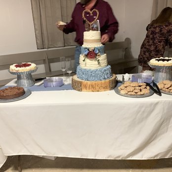 New City Bakery - a man standing in front of a cake table - Bakeries Near Me - New Braunfels, Texas