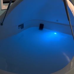 Infinity Floating & Healing Center - Pod with top lights on, and lights in water on