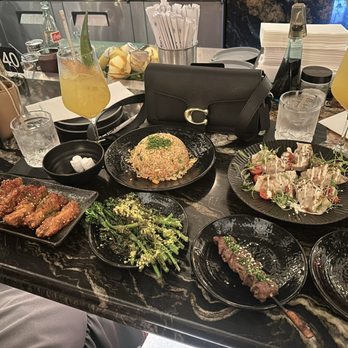 The Moderne - KFC, broccolini, beef skewer, chicken skewer, fried rice, and shrimp and pork gyozas - Tapas/Small Plates Near Me - Orlando, Florida The Moderne - KFC, broccolini, beef skewer, chicken skewer, fried rice, and shrimp and pork gyozas - Tapas/Small Plates Near Me - Orlando, Florida