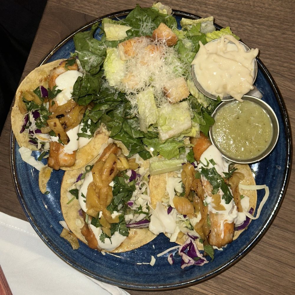 Eureka! - Al Pastor Fish Tacos grilled mahi mahi / pineapple / cabbage / green onions / cilantro / crema - American Near Me - Fresno, California Eureka! - Al Pastor Fish Tacos grilled mahi mahi / pineapple / cabbage / green onions / cilantro / crema - American Near Me - Fresno, California