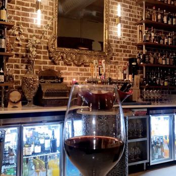 Primrose Path - a glass of wine in front of a bar - Wine Bars Near Me - College Station, Texas Primrose Path - a glass of wine in front of a bar - Wine Bars Near Me - College Station, Texas