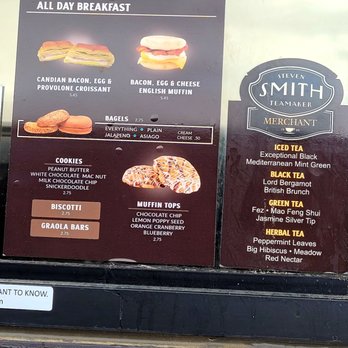 The Human Bean - Menu/Food Choice - A menu board at a coffee stand offers breakfast sandwiches, baked goods, muffin toppings, and various teas, including herbal and green options. - Coffee & Tea Near Me - Albuquerque, New Mexico