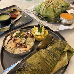 Biryani, fish curry in banan leaf and mango dessert! Biryani, fish curry in banan leaf and mango dessert!