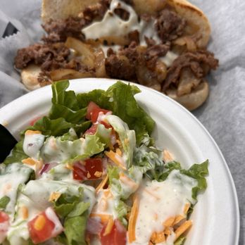 The Grill at Willow Lakes - Philly cheesesteak with side salad - Burgers Near Me - Bellevue, Nebraska The Grill at Willow Lakes - Philly cheesesteak with side salad - Burgers Near Me - Bellevue, Nebraska