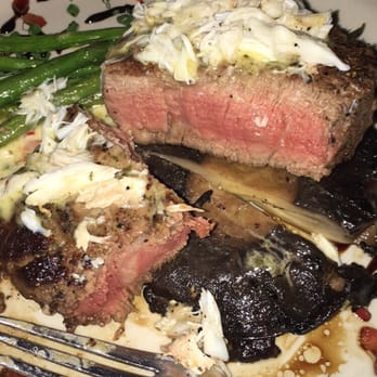 Opus 9 Steakhouse - Oscar 9- filet cooked medium with lump crabmeat on a mushroom with a béarnaise sauce and asparagus. DELICIOUS - Steakhouses Near Me - Williamsburg, Virginia