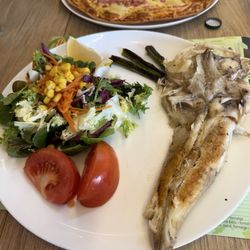 Monica - Fish, salad and asparagus spears. Ham and pineapple pizza in the background
