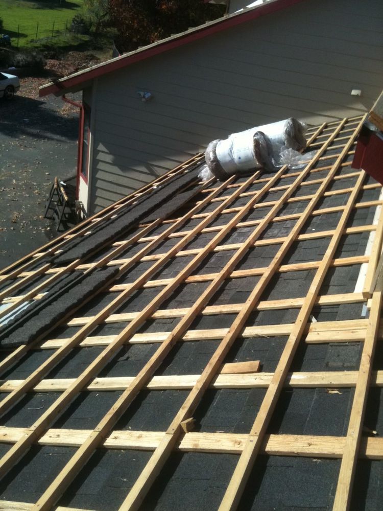 Slide of At the Top Roofing