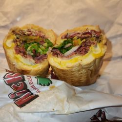 Mickey's Italian Delicatessen & Liquor Store - Pastrami Deluxe on a French Roll with Provolone - Very good.