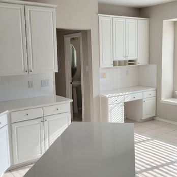 Yeager Properties - a kitchen with white cabinets - General Contractors Near Me