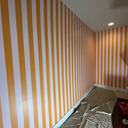 Epic Painting - Circus tent stripes paint job in the bunk bedroom, and one of two coats of paint on the front door