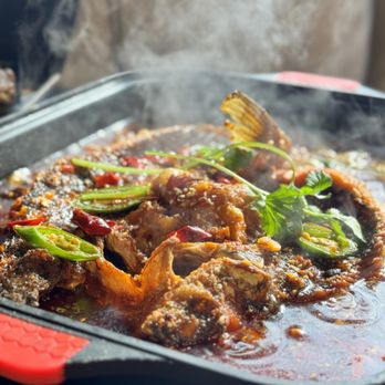 Tasty Dining - a pan of food being cooked - Szechuan Near Me - San Gabriel, California Tasty Dining - a pan of food being cooked - Szechuan Near Me - San Gabriel, California