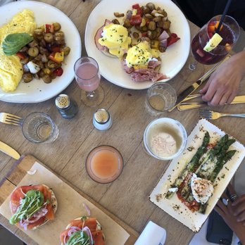 Driftwood Kitchen - Eggs Benedict, Grilled jumbo asparagus, Scottish smoked salmon bagel, and the Laguna Beach omelet (clockwise) - Seafood Near Me - Laguna Beach, California Driftwood Kitchen - Eggs Benedict, Grilled jumbo asparagus, Scottish smoked salmon bagel, and the Laguna Beach omelet (clockwise) - Seafood Near Me - Laguna Beach, California