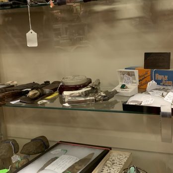 Gilley's Antique Mall - Knives and other items in a case - Antiques Near Me - Plainfield, Indiana