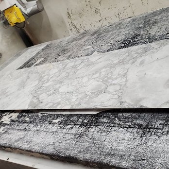 Creative Habitats - CNC after cutting a super white L shape for a bar in Somerville, NJ - Interior Design Near Me - Fanwood, New Jersey