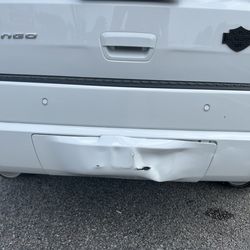 Rob's Auto Body - Damage to rear bumper and tow cover.