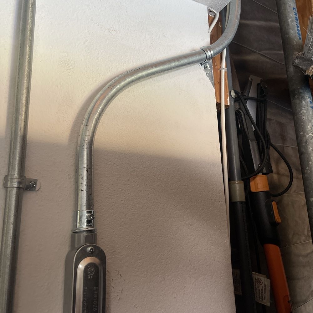Car Charger Guy - Entered the garage through the wall behind the Electrical Panel. - Electricians Near Me - Oceanside, California Car Charger Guy - Entered the garage through the wall behind the Electrical Panel. - Electricians Near Me - Oceanside, California