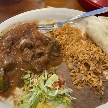 Camino Real Restaurant - Carne Guisada Plate served with your choice of tortillas, beans and rice - Mexican Near Me - Austin, Texas Camino Real Restaurant - Carne Guisada Plate served with your choice of tortillas, beans and rice - Mexican Near Me - Austin, Texas