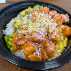 Poke Dream - Build your own poke bowl. This was my wife's custom bowl with double salmon and assorted ingredients. $13.85. Fresh and delicious.