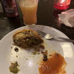a half eaten meal on a plate a half eaten meal on a plate