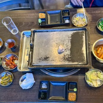 Soosanghan Kotedaeji - Grills are prepped with pieces of lard - Korean Near Me - Palisades Park, New Jersey Soosanghan Kotedaeji - Grills are prepped with pieces of lard - Korean Near Me - Palisades Park, New Jersey