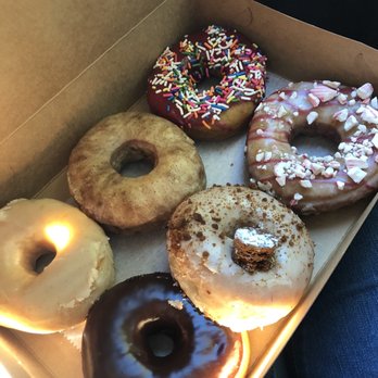 Vortex Doughnuts - Left-right/ top-bottom: Vanilla, Expresso, Raspberry with sprinkles, Chocolate, Ginger Bread, Peppermint - Coffee & Tea Near Me - Asheville, North Carolina