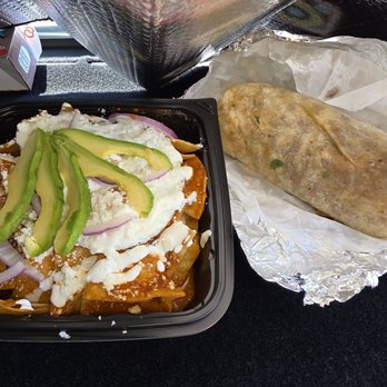 Maiz Y Fuego - I got me the Red Chilakiles with sunny side up eggs and my husband got a surf and turf burrito - Mexican Near Me - Van Nuys, California