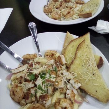 Spoons Grill & Bar - My plate and my friends plate. Bottom is the Tequila Chicken Pasta with added shrimp. Top plate is Fettuccine Alfredo with shrimp. - Mexican Near Me - Santa Ana, California Spoons Grill & Bar - My plate and my friends plate. Bottom is the Tequila Chicken Pasta with added shrimp. Top plate is Fettuccine Alfredo with shrimp. - Mexican Near Me - Santa Ana, California