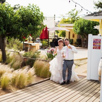 Seeker Vineyard - a bride and groom walking down the aisle - Wineries Near Me - San Martin, California Seeker Vineyard - a bride and groom walking down the aisle - Wineries Near Me - San Martin, California