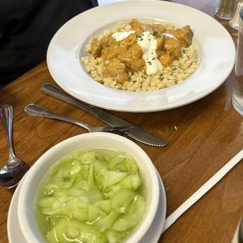 Vernona Gourmet Restaurant - Chicken paprika with goulash accompanied by cucumber salad - Hungarian Near Me - Bradenton, Florida Vernona Gourmet Restaurant - Chicken paprika with goulash accompanied by cucumber salad - Hungarian Near Me - Bradenton, Florida