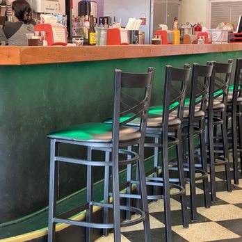 Tzango - a row of bar stools in a restaurant - Mexican Near Me - Macon, Georgia