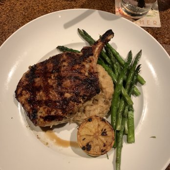 Seasons 52 - Wood grilled pork chop with asparagus n mashed cauliflower - New American Near Me - Sarasota, Florida Seasons 52 - Wood grilled pork chop with asparagus n mashed cauliflower - New American Near Me - Sarasota, Florida