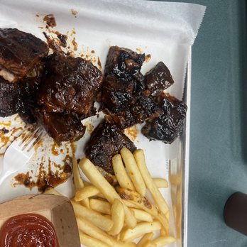 The Pit House Bar & Grill - ribs, fries and ketchup - Smokehouse Near Me - Delphi, Indiana The Pit House Bar & Grill - ribs, fries and ketchup - Smokehouse Near Me - Delphi, Indiana