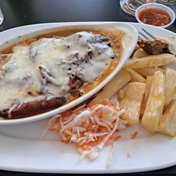 Fritanga - Canoa: plantains stuffed with marinated shredded beef and topped with cheese - Latin American Near Me - Saint Louis, Missouri Fritanga - Canoa: plantains stuffed with marinated shredded beef and topped with cheese - Latin American Near Me - Saint Louis, Missouri