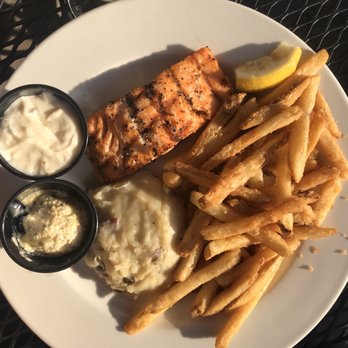 Houlihan's - Fire-Roasted Salmon (5 oz; $15.99) with fries and potatoes -- yummy! - New American Near Me - Brick Township, New Jersey Houlihan's - Fire-Roasted Salmon (5 oz; $15.99) with fries and potatoes -- yummy! - New American Near Me - Brick Township, New Jersey