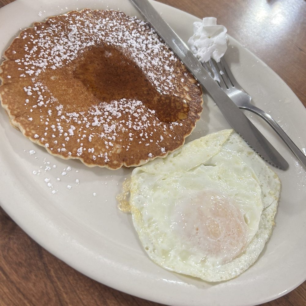 The Broken Egg Cafe - Pancake with an over medium egg. - Breakfast & Brunch Near Me - San Antonio, Texas The Broken Egg Cafe - Pancake with an over medium egg. - Breakfast & Brunch Near Me - San Antonio, Texas