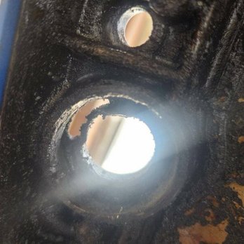 Hood Northlake Chevrolet - Actual hole discovered on the engine valve cover - Car Dealers Near Me - Covington, Louisiana Hood Northlake Chevrolet - Actual hole discovered on the engine valve cover - Car Dealers Near Me - Covington, Louisiana
