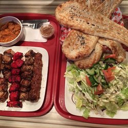 Afghan Cuisine - Family Value Combo: 1 chicken tandoori, 2 chicken kabob, 2 chicken sheekh, chicken qorma, salad, 4 naan (rice and 4 pop not in the picture)