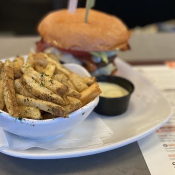 Big Orange | Midtown Little Rock - a hamburger and fries on a plate - Salad Near Me - Little Rock, Arkansas