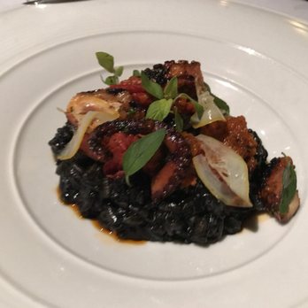 Acquerello - Squid ink risotto, charred octopus, tomato soffritto, Calabrian chili, and Meyer lemon - Italian Near Me - San Francisco, California Acquerello - Squid ink risotto, charred octopus, tomato soffritto, Calabrian chili, and Meyer lemon - Italian Near Me - San Francisco, California