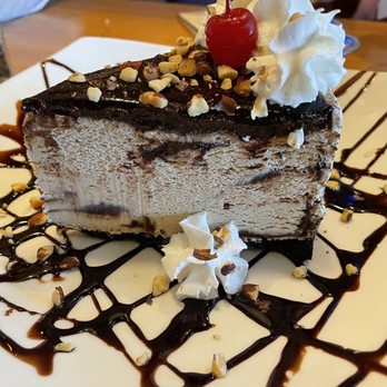 Islands Restaurant - Kona pie: Mocha almond fudge ice cream with a cookie crust topped w/chocolate fudge, whipped cream, roasted almonds and a cherry - Burgers Near Me - Carlsbad, California Islands Restaurant - Kona pie: Mocha almond fudge ice cream with a cookie crust topped w/chocolate fudge, whipped cream, roasted almonds and a cherry - Burgers Near Me - Carlsbad, California