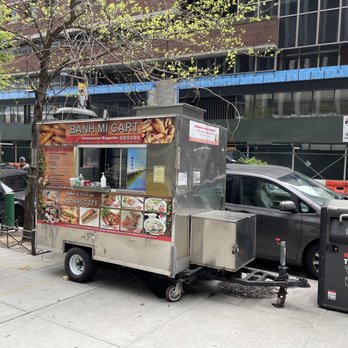 Banh Mi Cart - a man standing in front of a food truck - Vietnamese Near Me - New York, New York