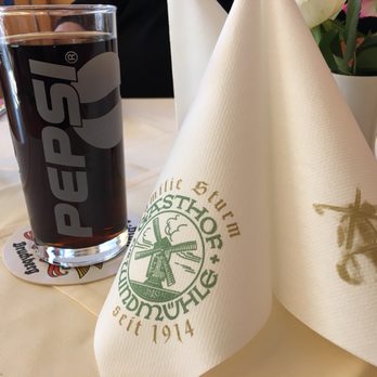 Windmühle Ost - Here's a photo of the napkin display and my Coca-Cola in a Pepsi glass. - German Near Me - Ansbach, BY