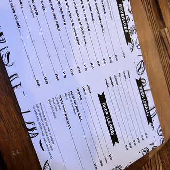 Tho One Thai Eatery - a menu on a wooden table - Thai Near Me - La Verne, California