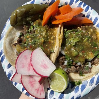 Tacos Durango - a person holding a plate of tacos - Food Trucks Near Me - Merced, California