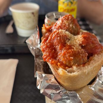 Da Nando - Meatball culetto with a royal being enjoyed in the background. - Italian Near Me - Williamsville, New York